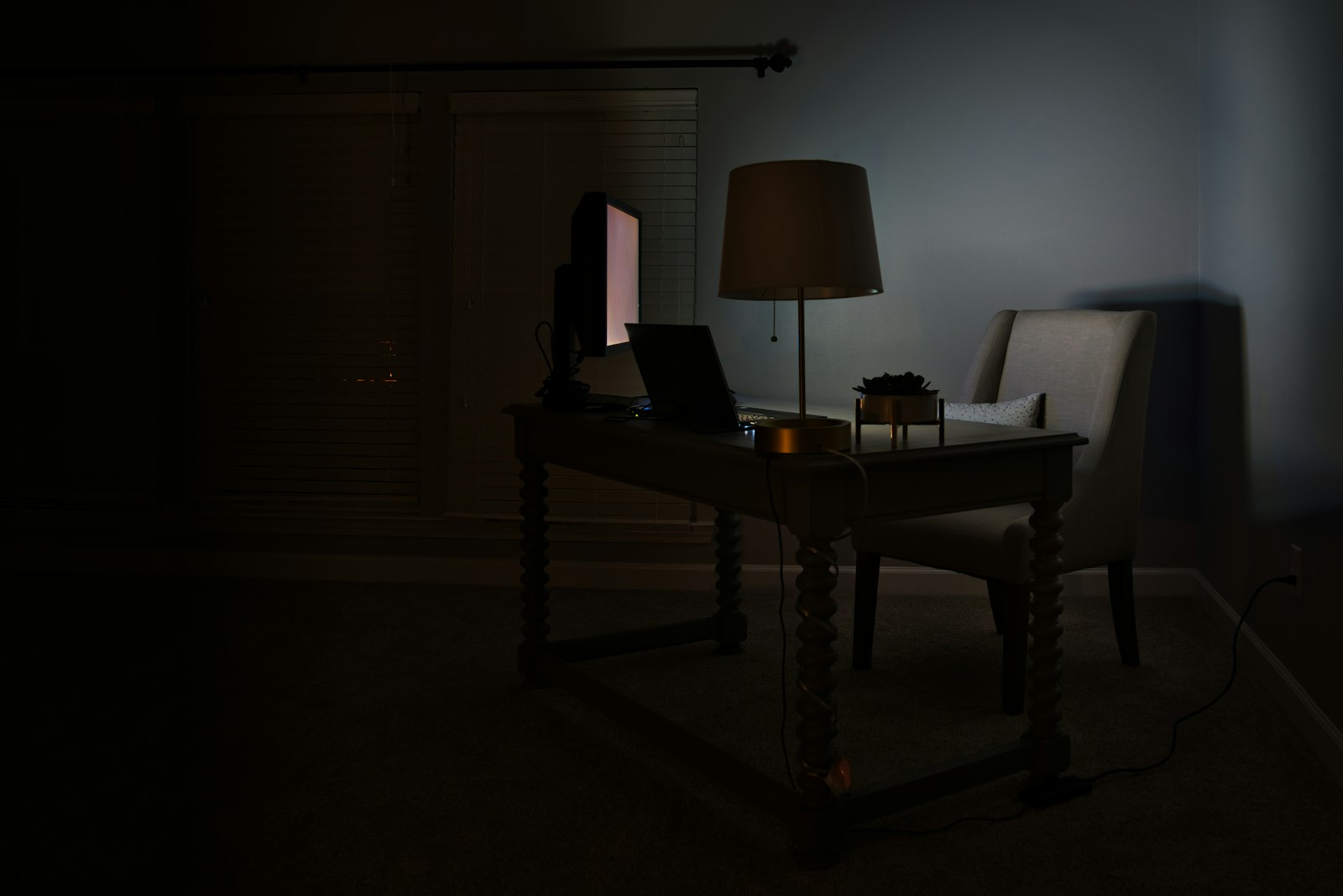 Person using a laptop in low light